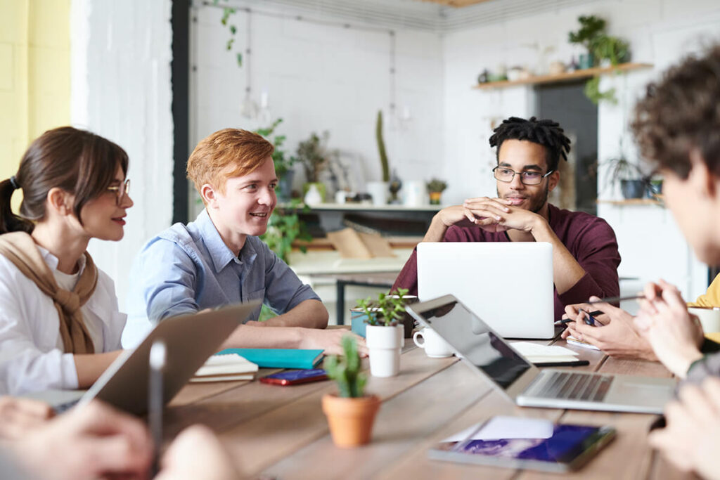 A group of people working on shared table