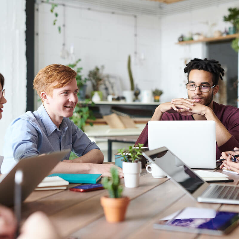 A group of people working on shared table